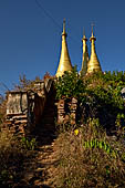 Inle Lake Myanmar. Indein, a cluster of ancient stupas  ruined and overgrown with bushes, just behind the village. 